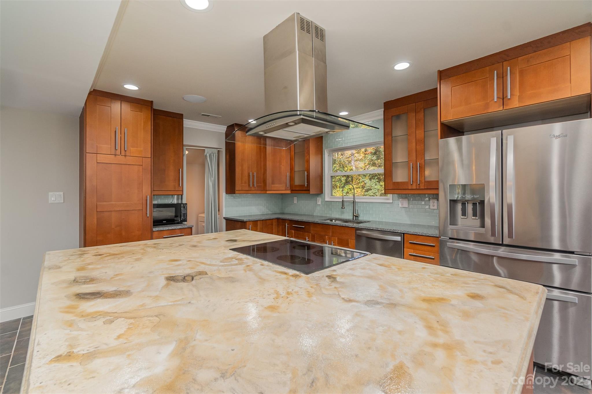 6745 Alanbrook Road Charlotte, NC 28215 - Photo 4 of 28 a kitchen with stainless steel appliances a sink and a refrigerator