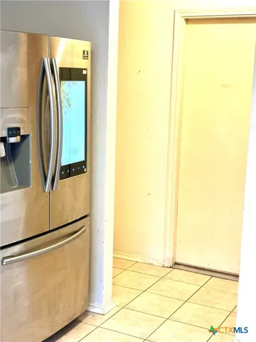 a view of a kitchen with a refrigerator