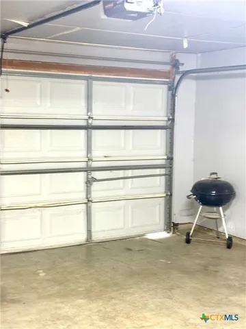 a view of a room with furniture and windows