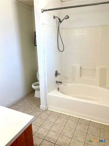 a bathroom with a sink a toilet and a bathtub