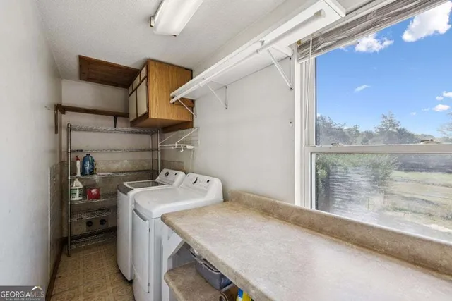 a en suite bathroom with a sink and window