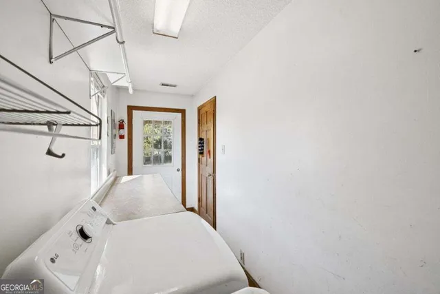 a view of a room with wooden walls