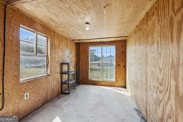 a view of an entryway with wooden floor
