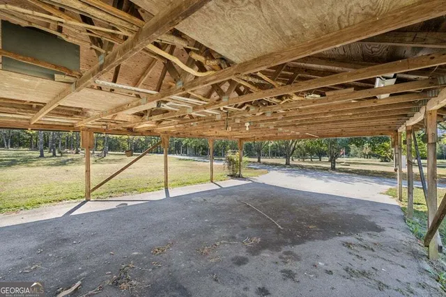 a front view of a house with a yard table and chairs
