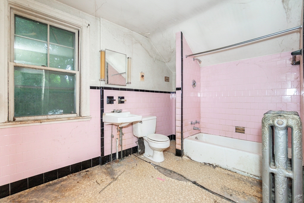 270 Garden Street Fall River, MA 02720 - Photo 13 of 36 a bathroom with a sink a toilet and shower