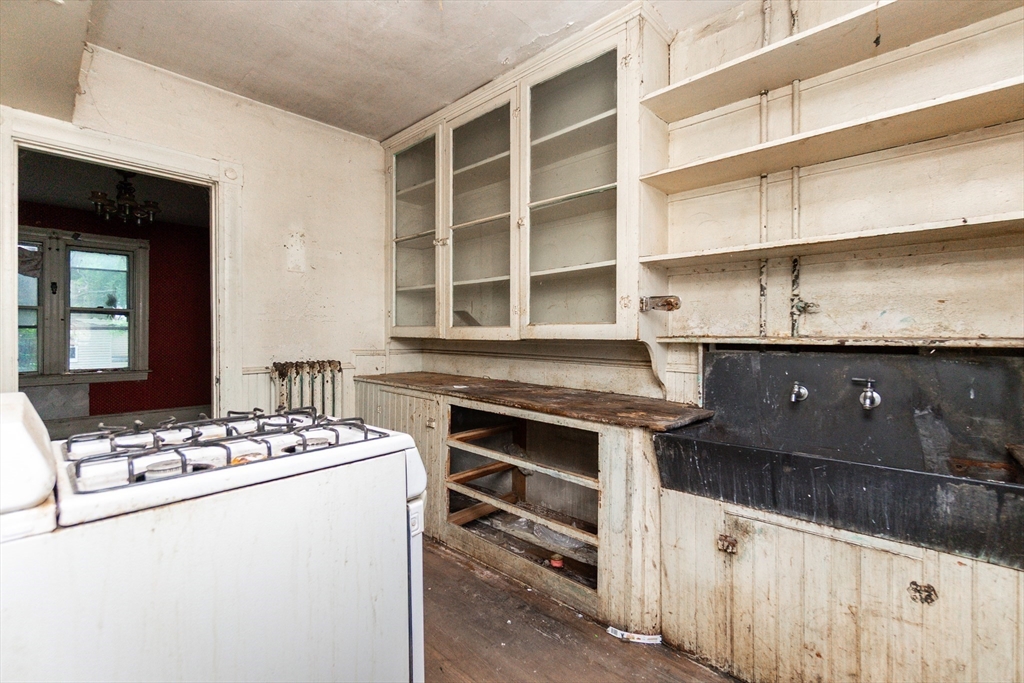 270 Garden Street Fall River, MA 02720 - Photo 14 of 36 a kitchen with a stove and a cabinets