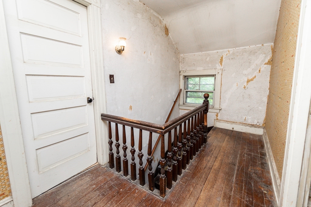 270 Garden Street Fall River, MA 02720 - Photo 16 of 36 a view of a hallway with wooden floor and staircase