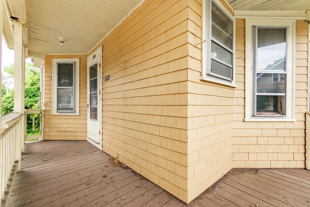 270 Garden Street Fall River, MA 02720 - Photo 30 of 36 a view of a porch with wooden floor and a balcony