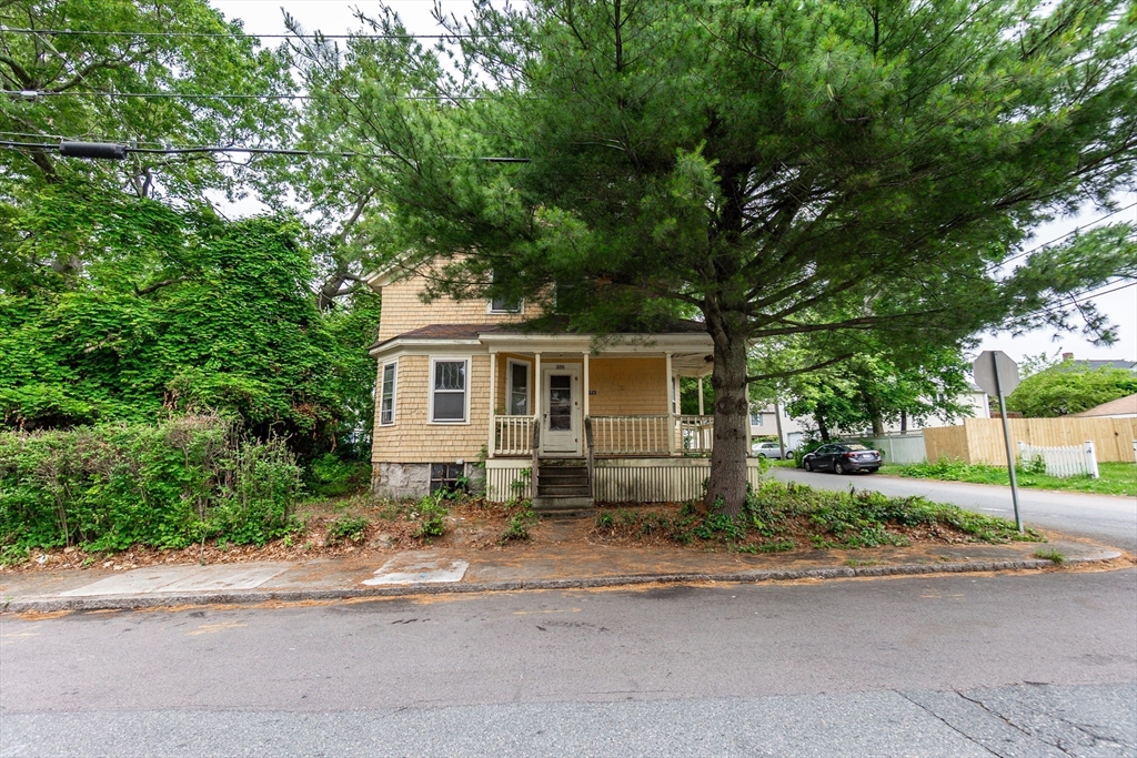 270 Garden Street Fall River, MA 02720 - Photo 31 of 36 a front view of a house with a yard and garage