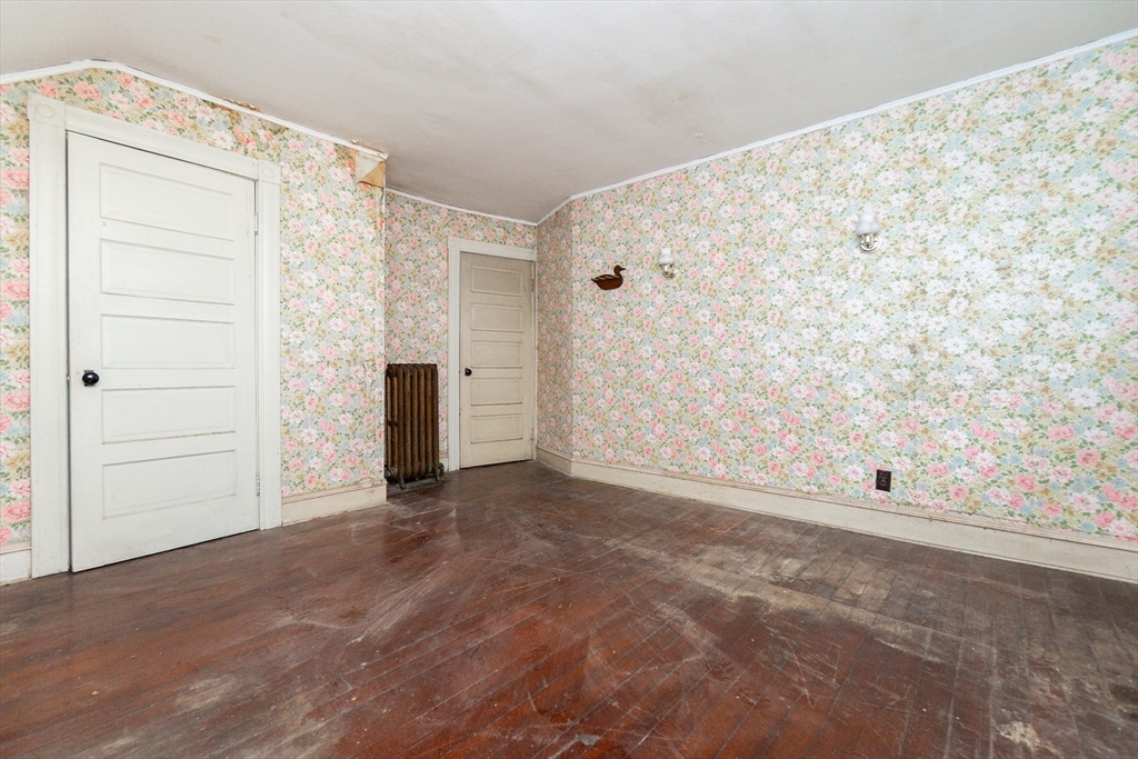 270 Garden Street Fall River, MA 02720 - Photo 8 of 36 an empty room with wooden floor and closet