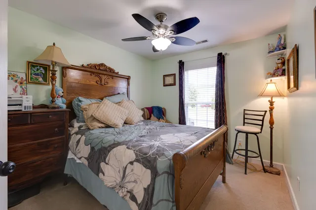 a bathroom with a toilet a sink a bathtub a mirror and vanity