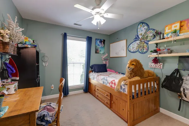 a bedroom with a bed and a tv in it