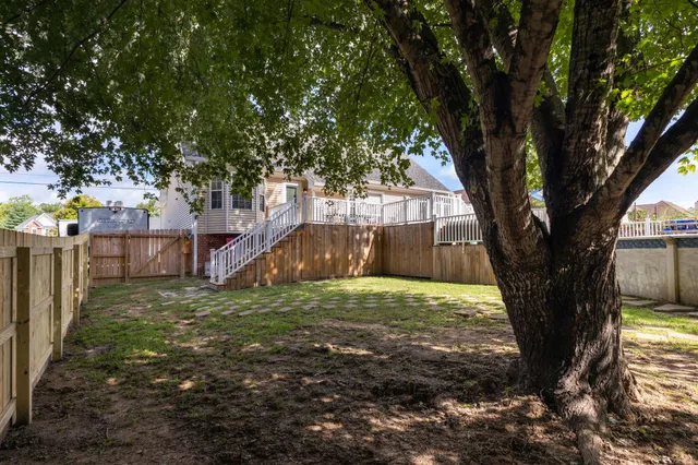 a view of outdoor space with deck and backyard