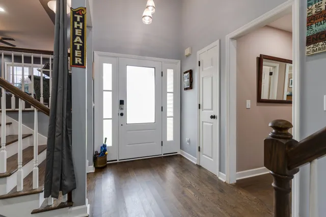 a living room with fireplace furniture and a flat screen tv