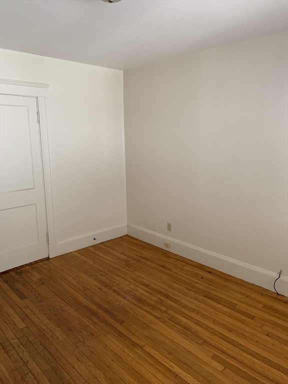 20 Prospect Avenue, Unit 8 Quincy, MA 02170 - Photo 4 of 13 a view of an empty room with wooden floor