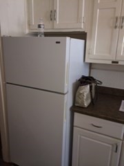 20 Prospect Avenue, Unit 8 Quincy, MA 02170 - Photo 8 of 13 a close view of a refrigerator a sink and cabinets