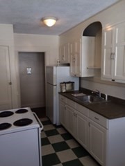 20 Prospect Avenue, Unit 8 Quincy, MA 02170 - Photo 9 of 13 a kitchen with a sink and a stove