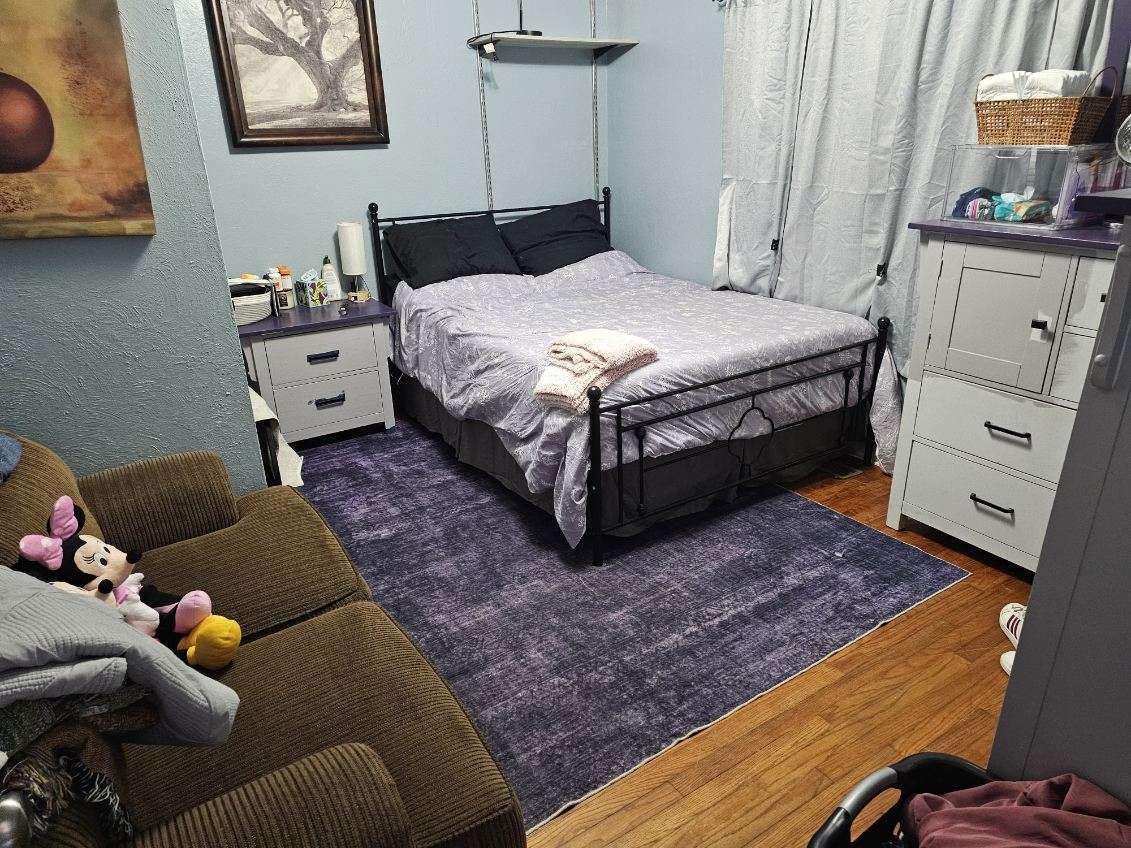 921 Airport Road Mount Vernon, IL 62864 - Photo 18 of 26 a bedroom with a bed and wooden floor