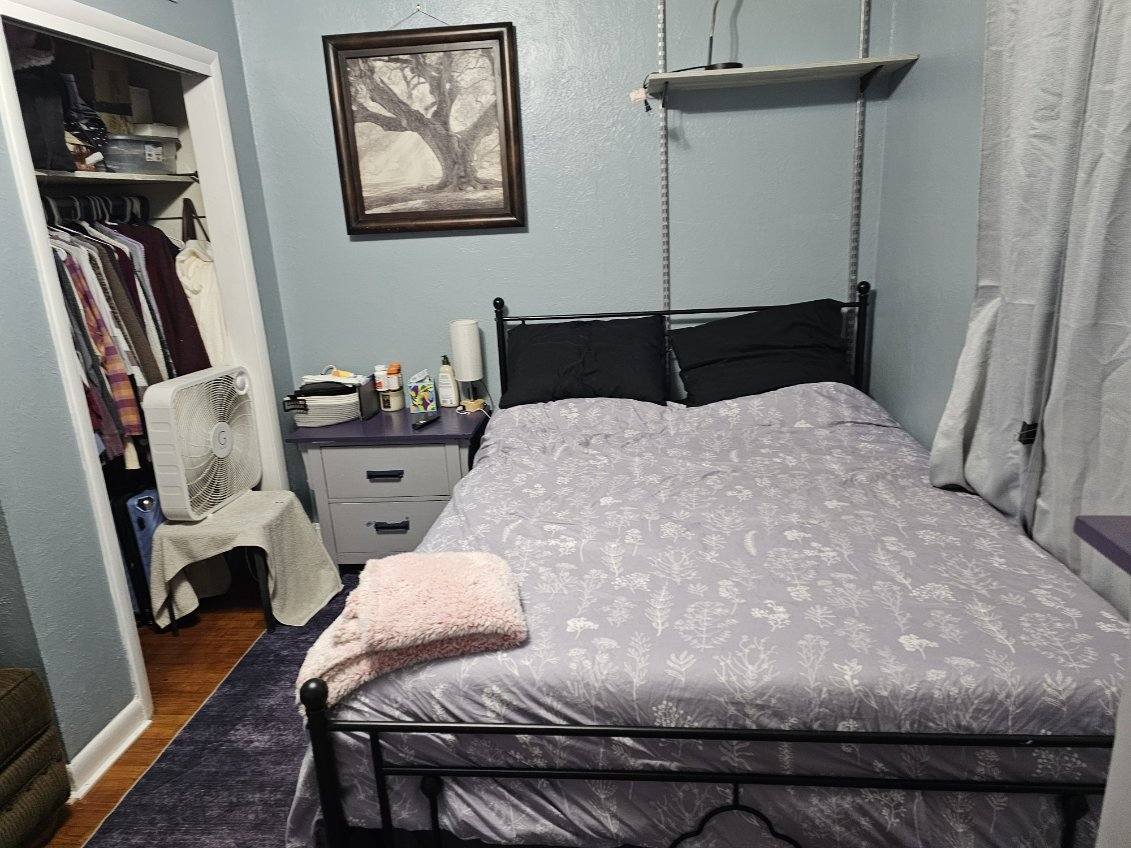 921 Airport Road Mount Vernon, IL 62864 - Photo 19 of 26 a bedroom with a bed and wooden floor