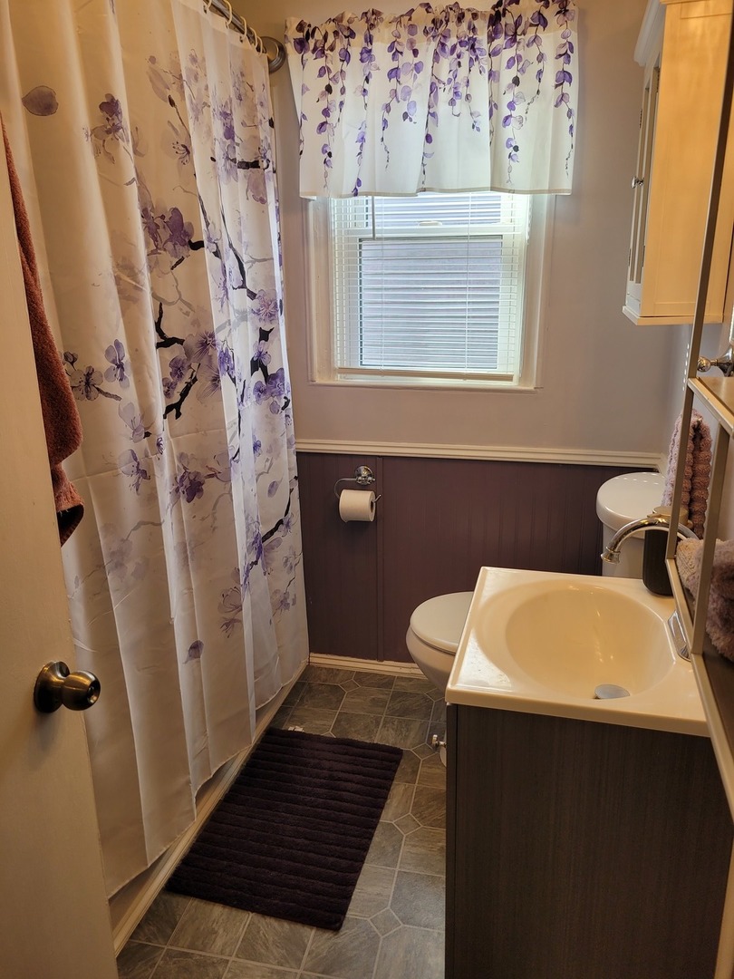 921 Airport Road Mount Vernon, IL 62864 - Photo 22 of 26 a bathroom with a sink and a mirror