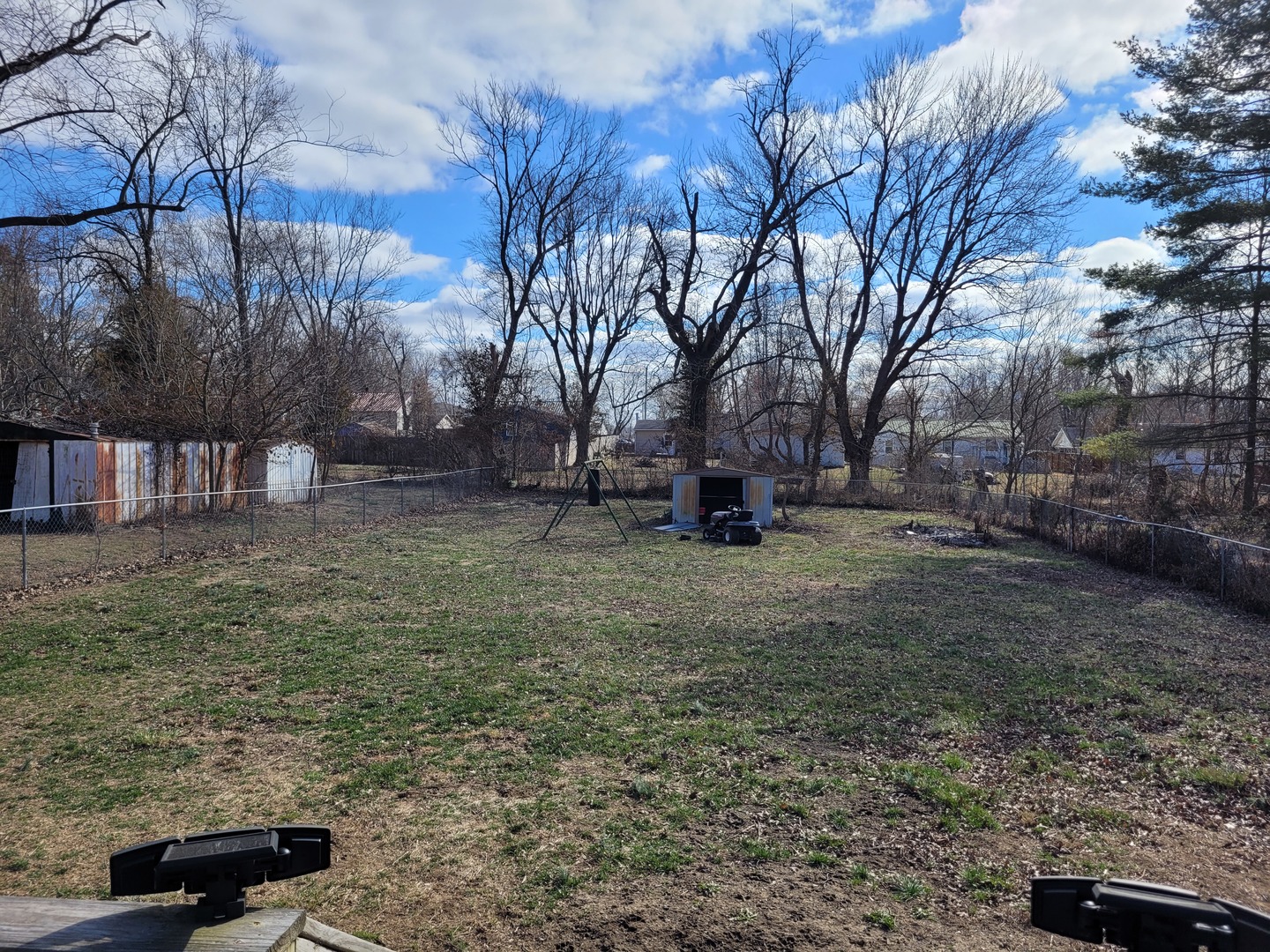 921 Airport Road Mount Vernon, IL 62864 - Photo 7 of 26 a view of a backyard with wooden fence and large trees
