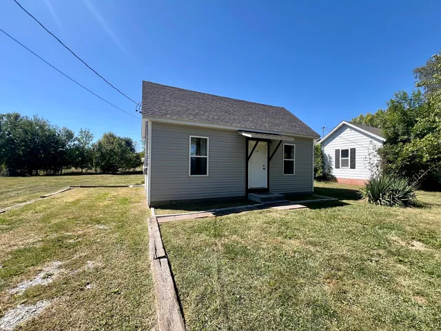 a house view with a backyard space