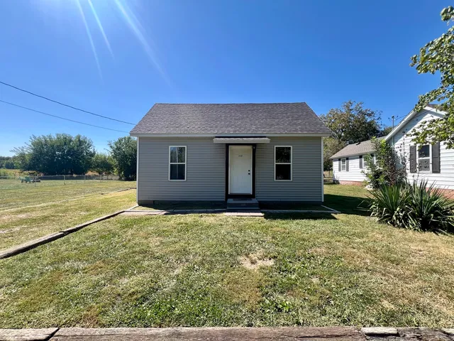 a house view with a garden space