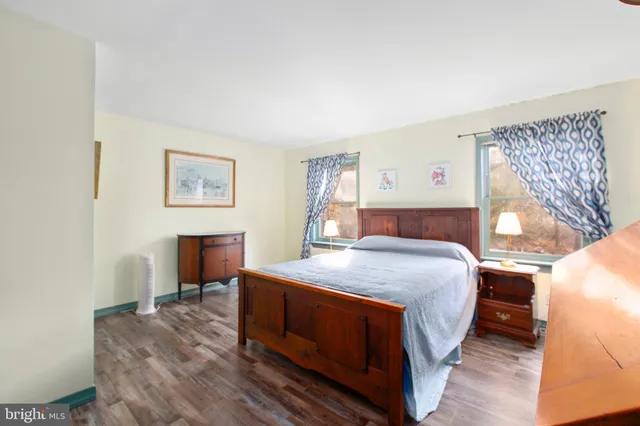 a bedroom with a bed and a desk