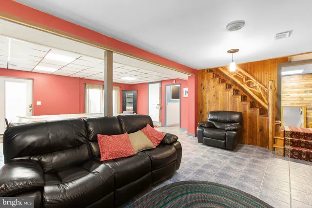 a living room with a couch and a flat screen tv