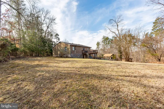 a view of open space with yard