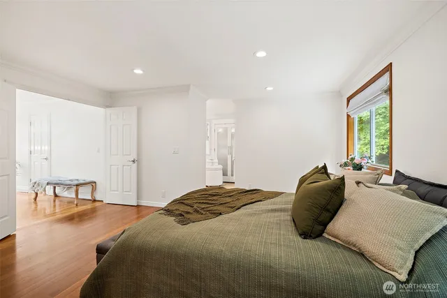 a bedroom with a bed and a table