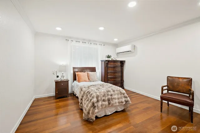 a bedroom with a bed and a chair