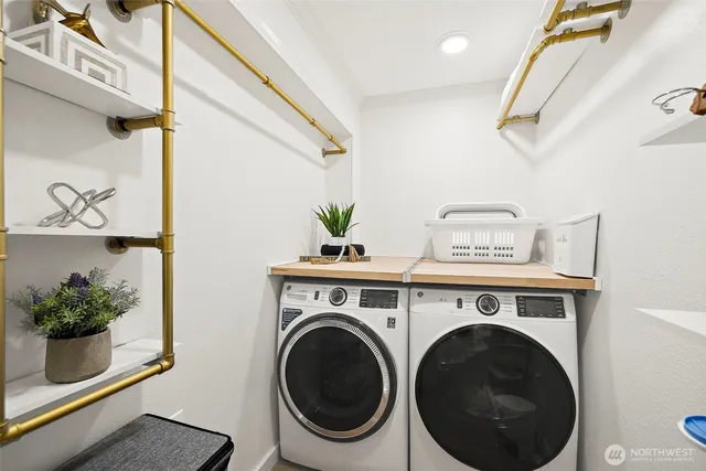 a view of washer and dryer in a bathroom