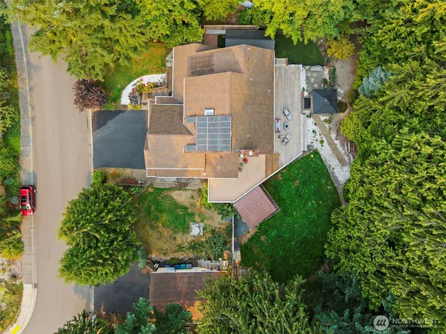 an aerial view of a house with a yard and garden