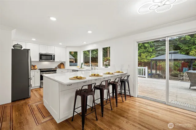 a kitchen with a table and chairs