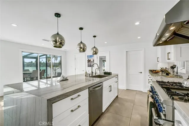 a view of a hallway with shelves and bathroom