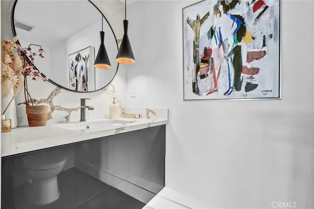 a view of a hallway with a chandelier