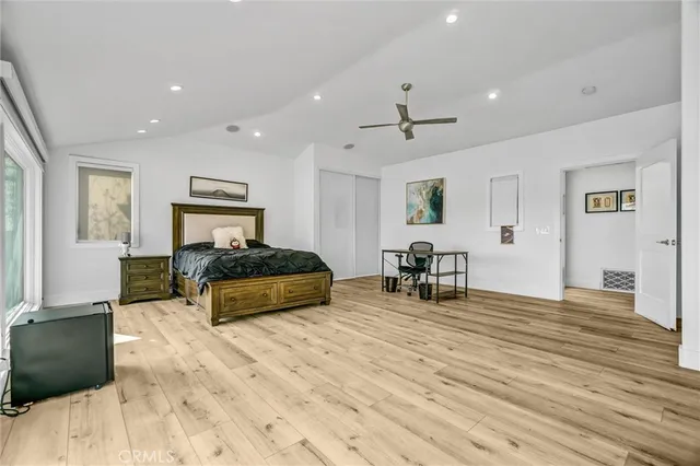 a bed room with a bed and dresser