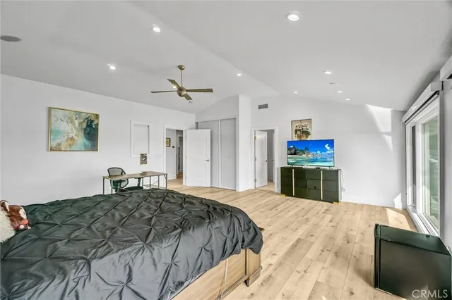 a bedroom with a bed and closet