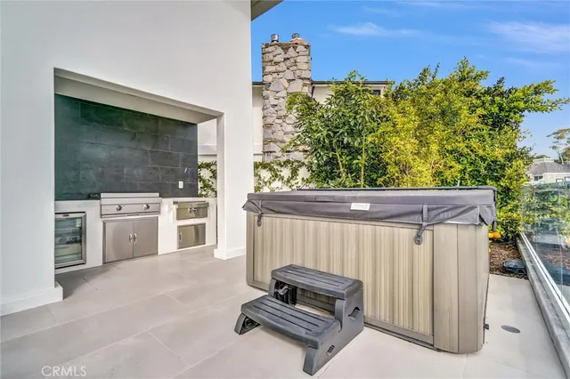 a balcony with table and chairs