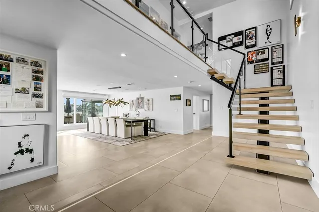 a living room with furniture a rug and white walls