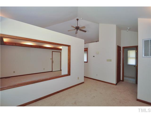 3441 Mill Run Raleigh, NC 27612 - Photo 7 of 13 Spacious master bedroom with new carpet and paint, up lighting, and smooth vaulted ceiling