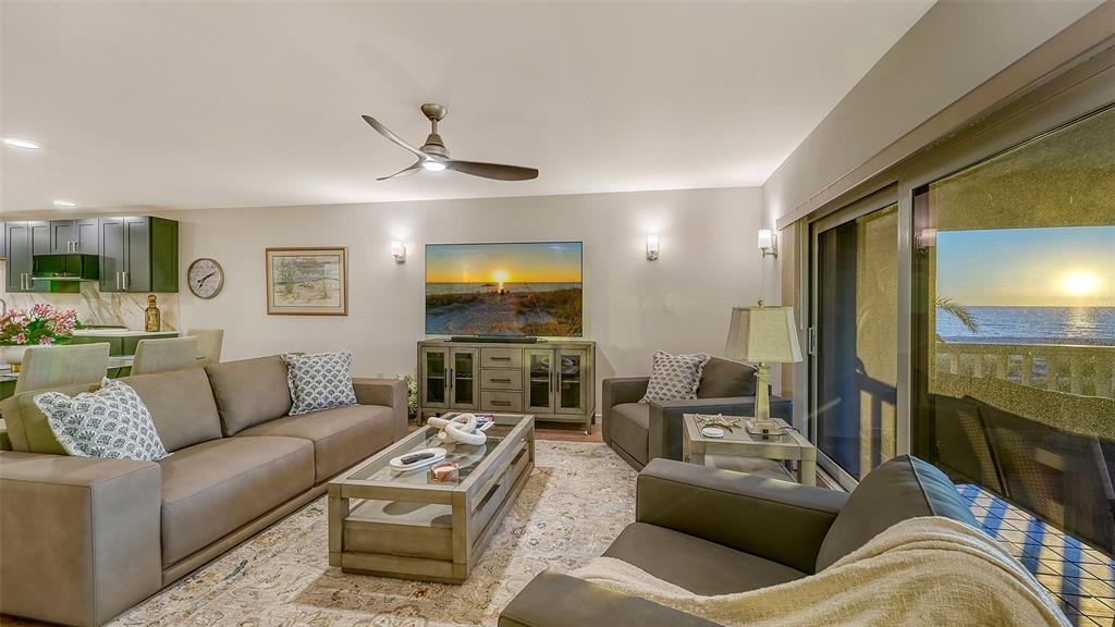 5757 Gulf Of Mexico Drive, Unit 204 Longboat Key, FL 34228 - Photo 11 of 71 a living room with furniture and a flat screen tv