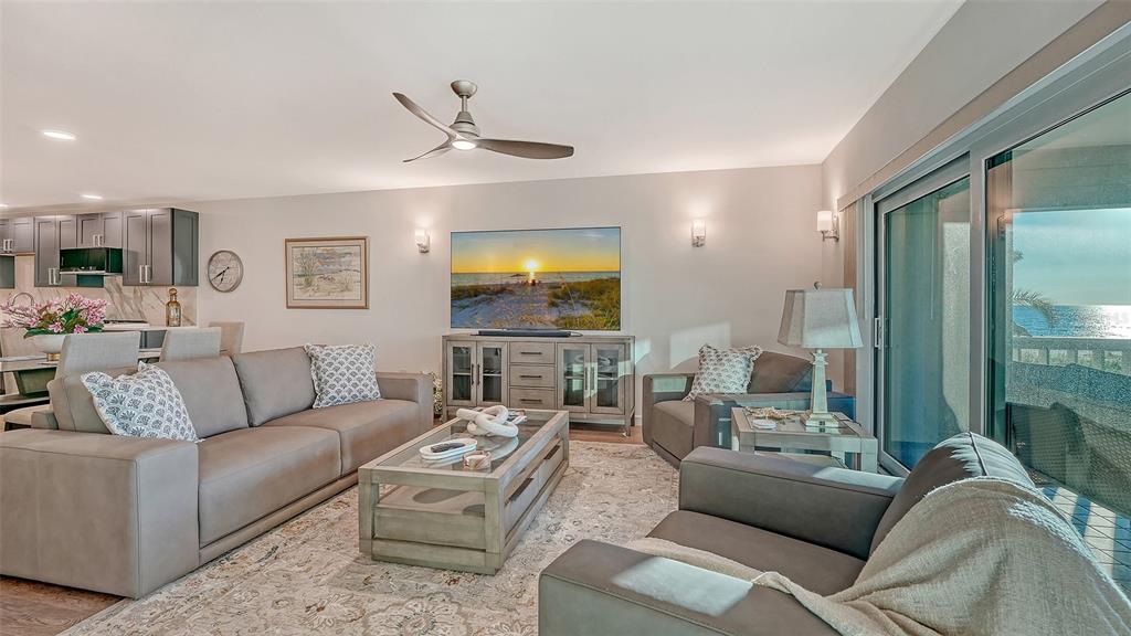 5757 Gulf Of Mexico Drive, Unit 204 Longboat Key, FL 34228 - Photo 12 of 71 a living room with furniture and a large window