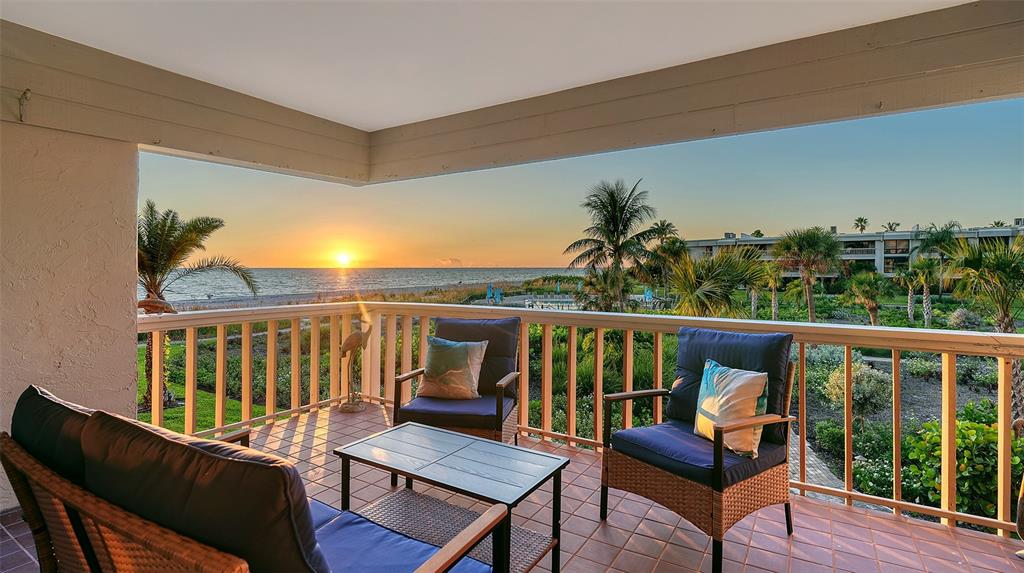 5757 Gulf Of Mexico Drive, Unit 204 Longboat Key, FL 34228 - Photo 16 of 71 a view of a chairs in balcony