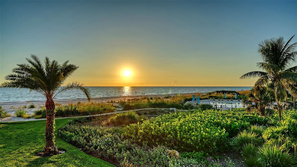 5757 Gulf Of Mexico Drive, Unit 204 Longboat Key, FL 34228 - Photo 18 of 71 a view of a yard and ocean view