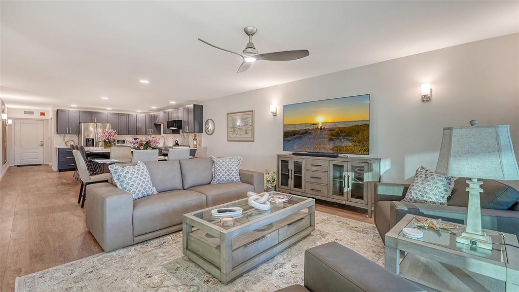 5757 Gulf Of Mexico Drive, Unit 204 Longboat Key, FL 34228 - Photo 22 of 71 a living room with furniture and a flat screen tv