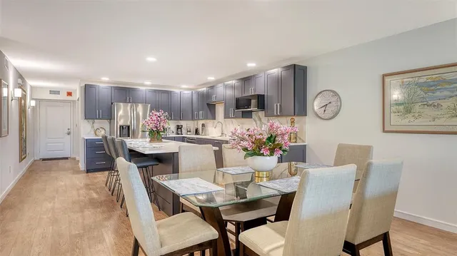 a spacious bedroom with a bed and a view of bathroom