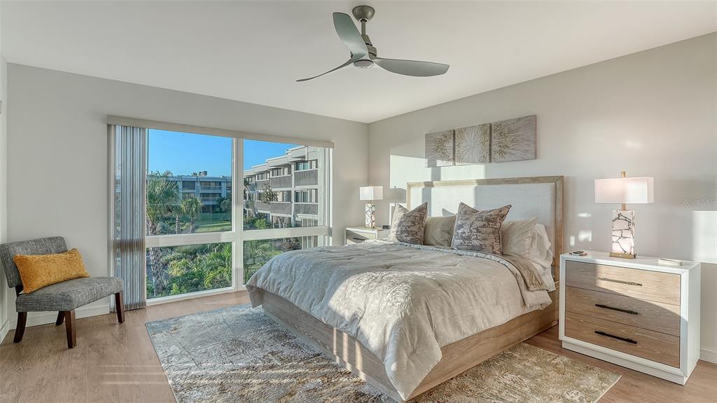 5757 Gulf Of Mexico Drive, Unit 204 Longboat Key, FL 34228 - Photo 33 of 71 a bedroom with a large bed and a window