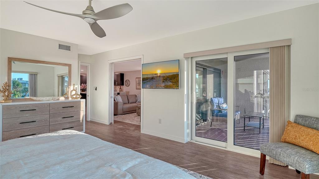 5757 Gulf Of Mexico Drive, Unit 204 Longboat Key, FL 34228 - Photo 38 of 71 a room with a dresser and a mirror